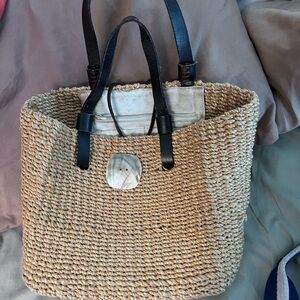 Stylish Tan Woven Tote Bag with Black Handles